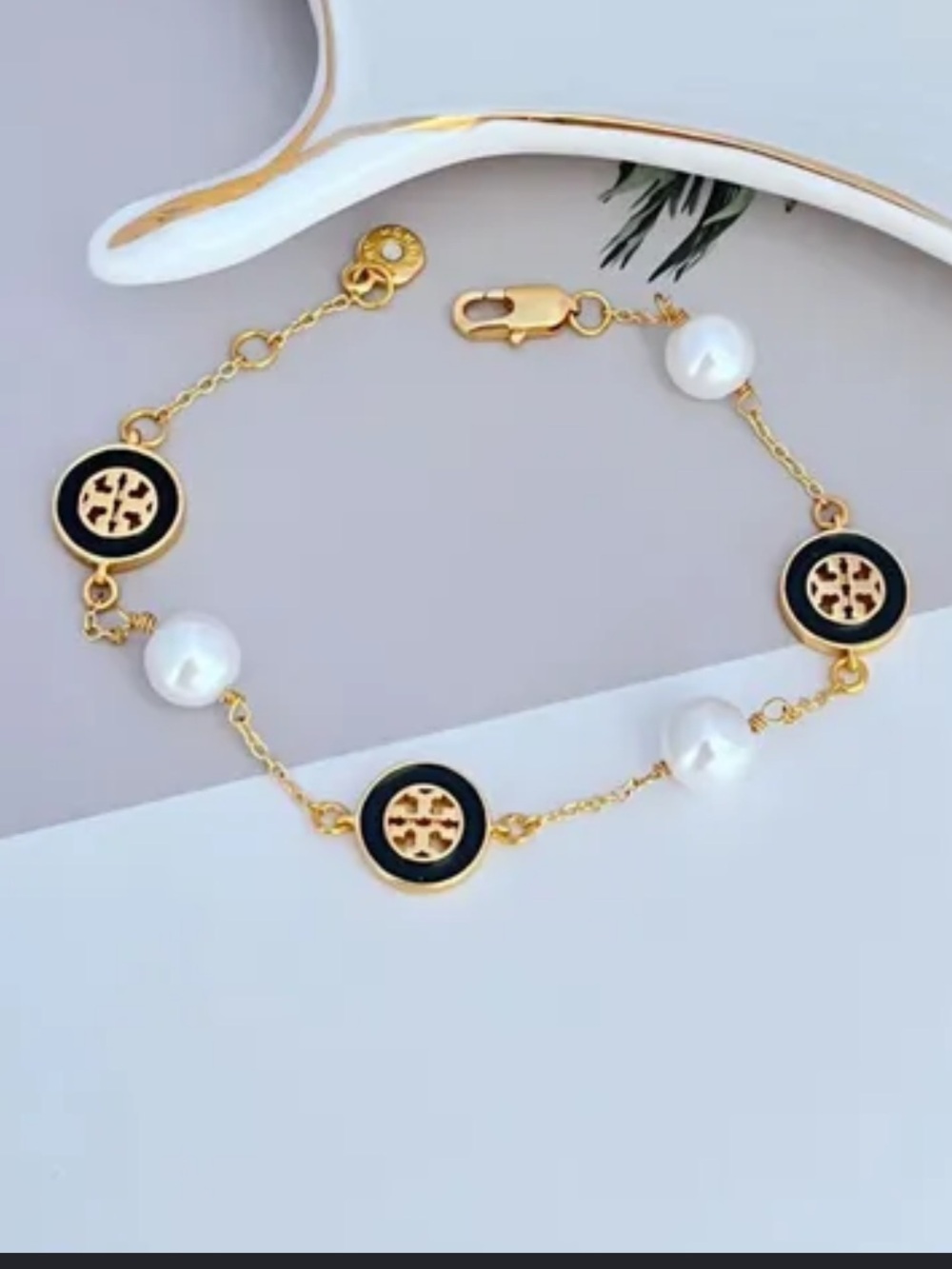 Tory Burch Gold, Black and White Logo Pearl Chain Bracelet
